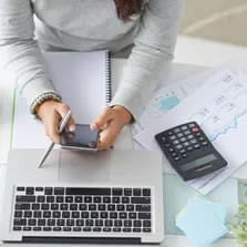 Woman using calculator